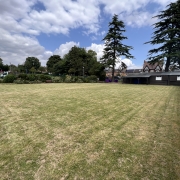 The Shack pictured from afar showing the large green space it sits on.